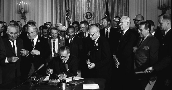 United States President Lyndon B. Johnson signed the Civil Rights Act into law featured image - LankaTricks